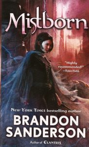 Cover of "Mistborn," featuring a short-haired girl in a dark cloak with a tall spire-like tower in the background