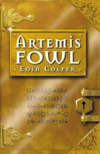 Cover of "Artemis Fowl," which is gold and designed to look like an old book with hinges and a lock and has a few lines of a hieroglyphic language