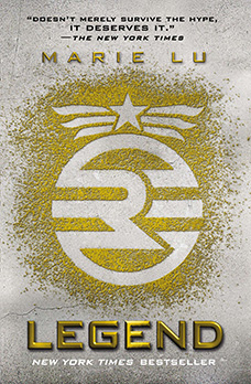 Cover of "Legend," featuring a strange R symbol with a circle around it drawn in gold dust on a silver background