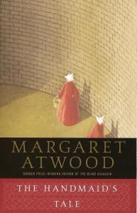 Cover of "The Handmaid's Tale," featuring two women in red cloaks and white bonnets standing near a tall brick wall