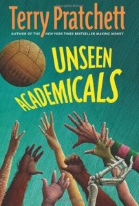 Cover of the book, featuring assorted hands - some human, two that look like monkey hands, and one skeleton hand - reaching up to grab a brown leather ball.