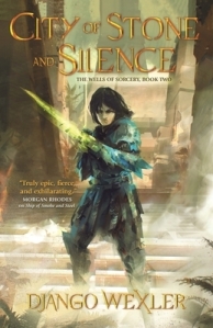 Cover of the book, featuring a dark-haired girl with a green blade made of light coming from her forearm standing on a set of stone stairs in front of large pale stone pillars.