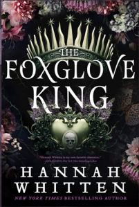 Cover of the book, featuring a pale gold crown with sword-like points and a mirror of the same color with a skull detail at the bottom, surrounded by a variety of light pink and light purple flowers.